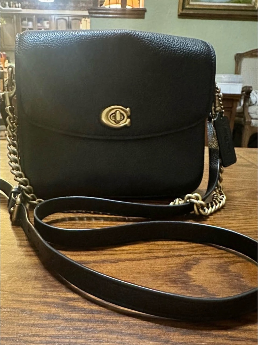 Black Leather Crossbody Bag with Gold Chain Accent